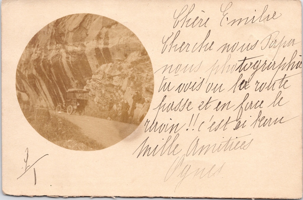 [G1811] Unknown - "" - Mountain road through a crevice in the rock featuring an early motor vehicle, sepia-toned photo card
