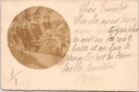 Unknown - "" - Mountain road through a crevice in the rock featuring an early motor vehicle, sepia-toned photo card
